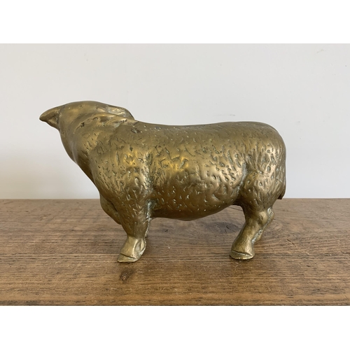 272 - A solid brass bull figurine, approx. 9 1/2