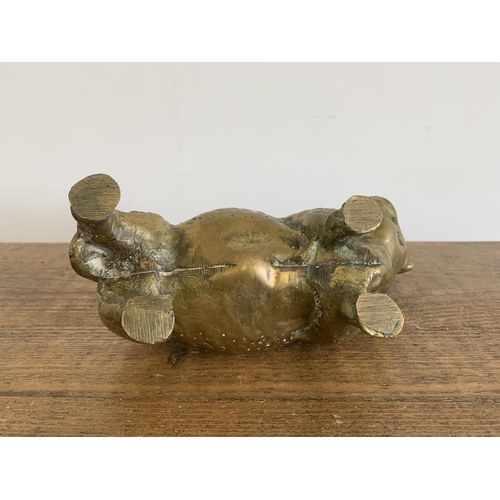 272 - A solid brass bull figurine, approx. 9 1/2