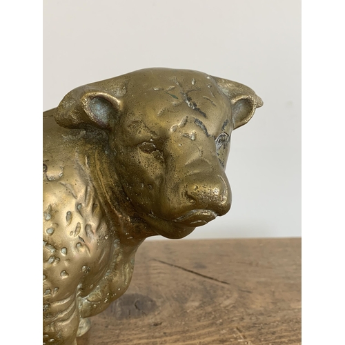 272 - A solid brass bull figurine, approx. 9 1/2