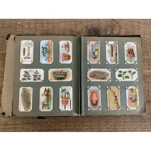 286 - A vintage album of cigarette cards plus a box of loose tea cards