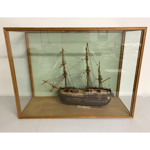 292 - A scratch built boat of H M Bark in a glass case, approx. case measurements 32