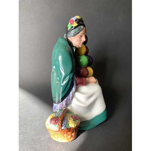 295 - A vintage Royal Doulton 'The Old Balloon Seller' HN1315 figurine, 7 1/2