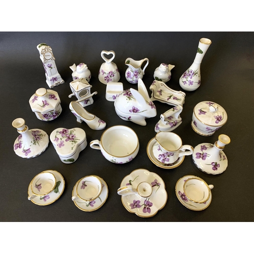 298 - A good selection of Hammersley miniature porcelain in the violet pattern