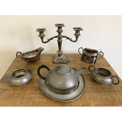 302 - A 'British made' pewter teapot, milk, sugar and plate plus a silver plated candelabra etc