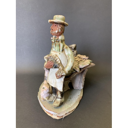 304 - A vintage Seven Springs pottery by Marie Whitby figure group 'The Fishmonger', approx. 8