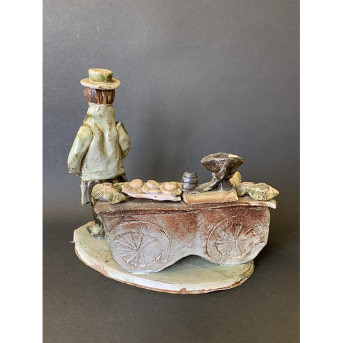 304 - A vintage Seven Springs pottery by Marie Whitby figure group 'The Fishmonger', approx. 8