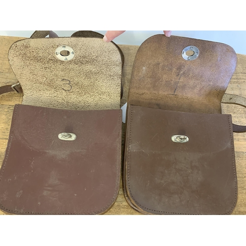 31 - Two vintage leather cash satchels