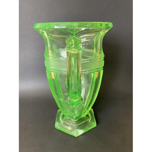 312 - An Art Deco era large moulded uranium two handled glass vase, 10 1/2