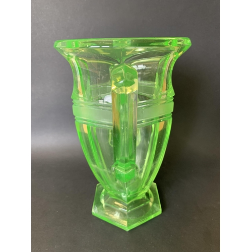 312 - An Art Deco era large moulded uranium two handled glass vase, 10 1/2