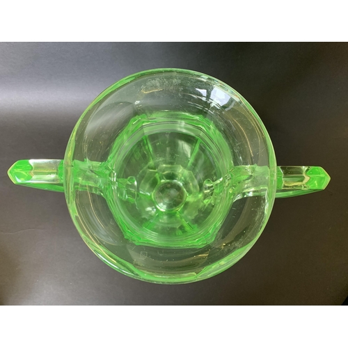 312 - An Art Deco era large moulded uranium two handled glass vase, 10 1/2