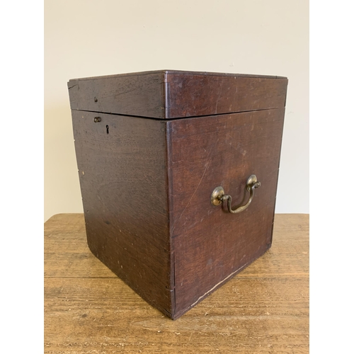 33 - An antique mahogany lidded box with two brass carry handles, 13