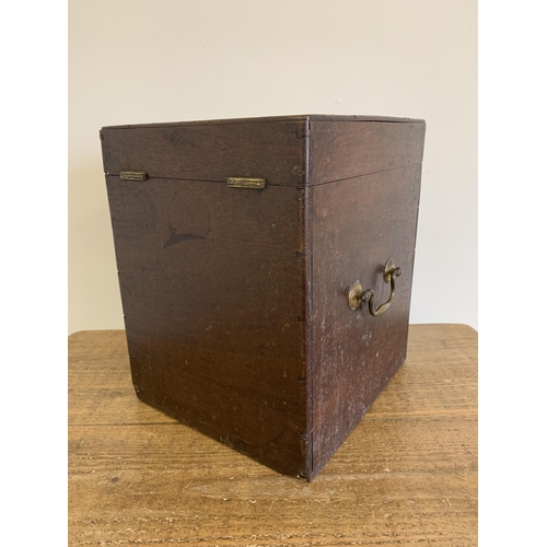 33 - An antique mahogany lidded box with two brass carry handles, 13