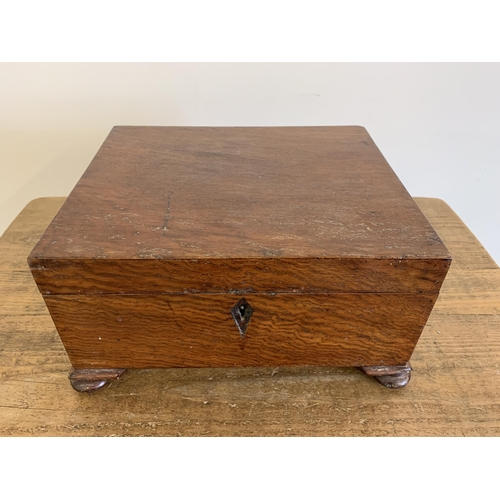 34 - An antique wood former sewing box, 12