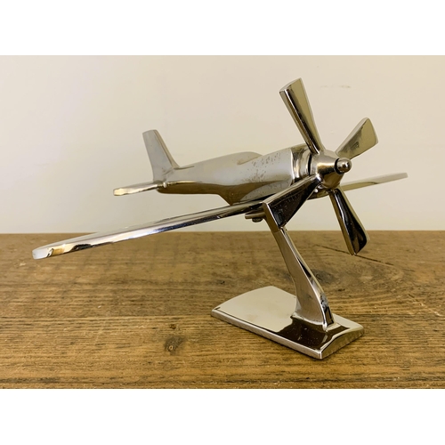 37 - A modern still boxed chrome finish model plane, 7