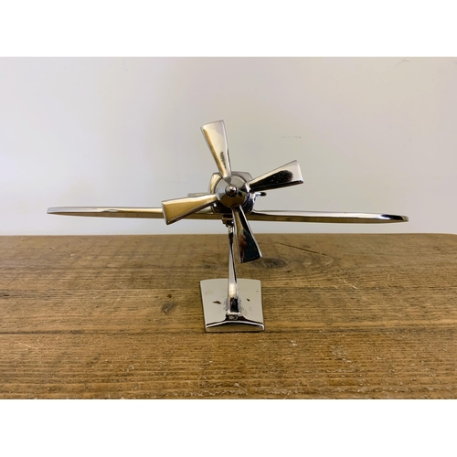 37 - A modern still boxed chrome finish model plane, 7