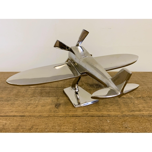 37 - A modern still boxed chrome finish model plane, 7