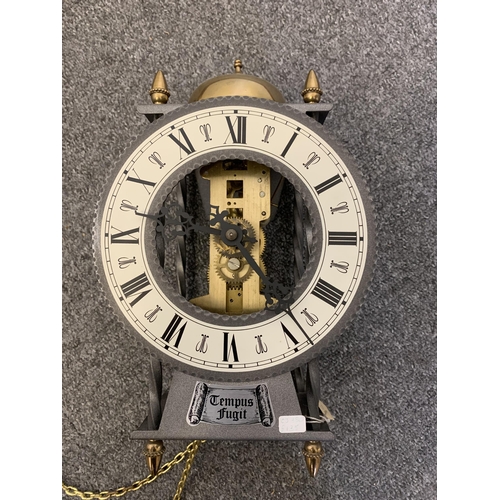 38 - A boxed 'Tudor' battery pendulum wall clock with glass front and wood effect sides, 25 1/2