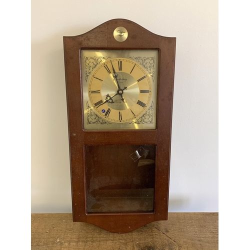 39 - A boxed Canterbury Clock Co Ltd quartz wall clock, model 3534 with passing strike, 20 1/2