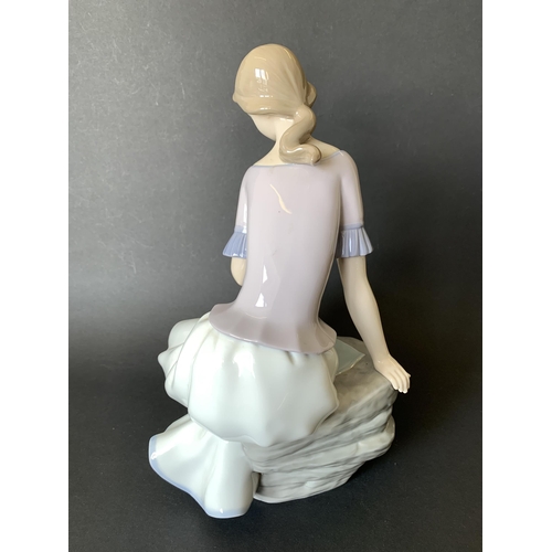 5 - A large Lladro Nao figurine, girl with flower, 11