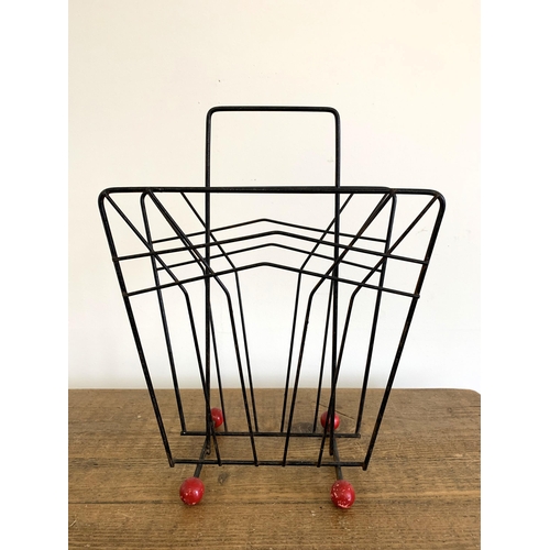 51 - A vintage magazine/paper rack, 16