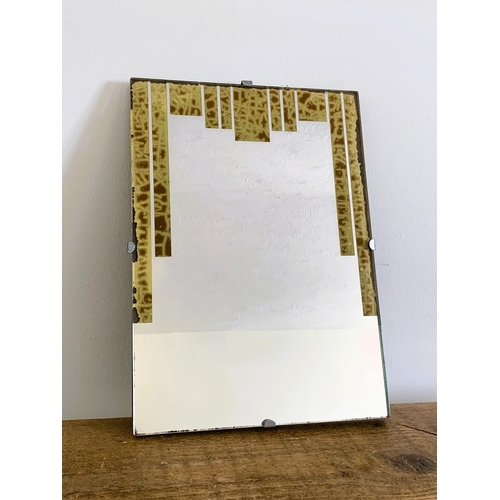 52 - A vintage Art Deco wall mirror, 14