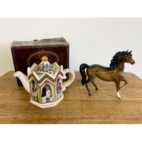 55 - A boxed Sadler Battle of Waterloo teapot plus a Beswick horse