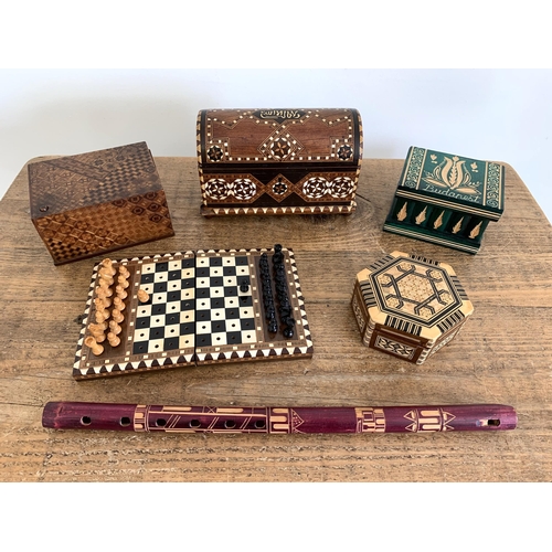 58 - Four wooden boxes, one inlaid with mother of pearl, a travel chess set and a wooden recorder