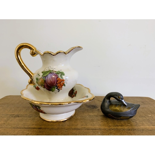 69 - A small Imperial Stafford factory jug and bowl plus a two colour metal duck trinket pot