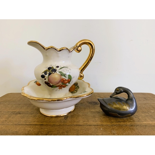 69 - A small Imperial Stafford factory jug and bowl plus a two colour metal duck trinket pot