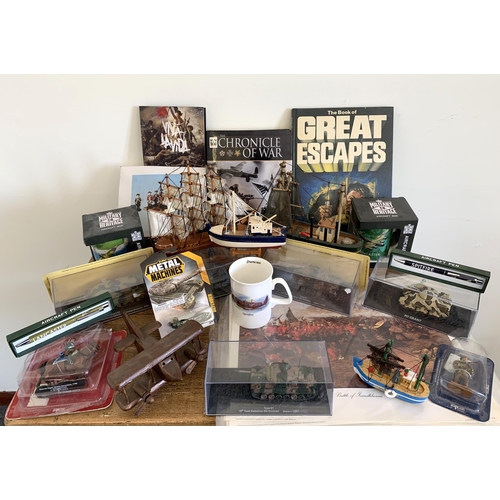 76 - Mixed military themed items including packaged tanks, model boats, books etc