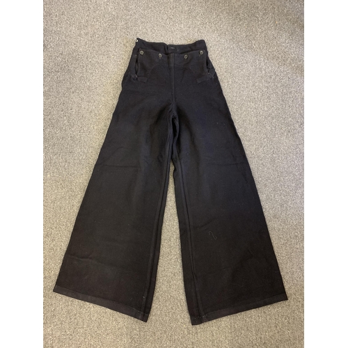 78 - A pair of vintage blue serge Navy bell bottom trousers with a 28