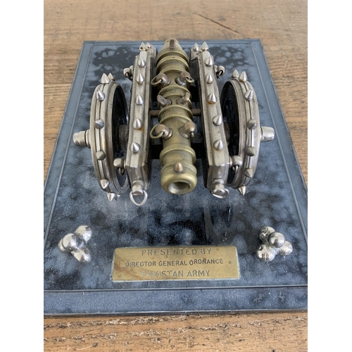 97 - A vintage presentation cannon on perspex base, plaque reads 'Presented by Director General Ordnance,... 