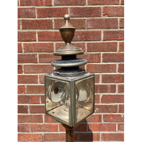 358 - An unusual vintage copper based standard lamp with carriage lamp style top, adjustable column and fo... 