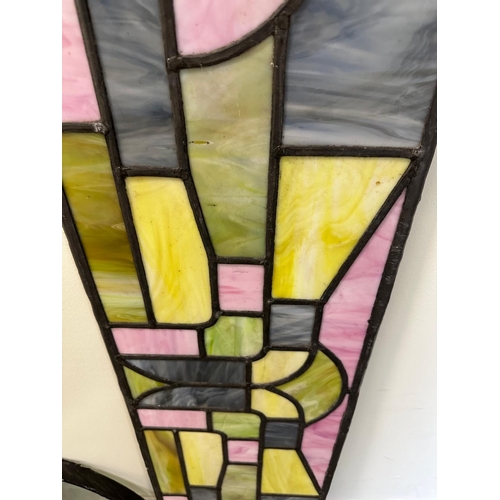 367 - An oblong leaded glass panel, 43