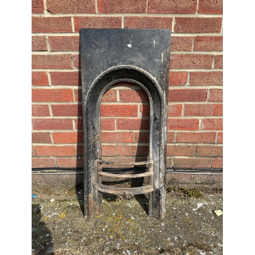 371 - An antique cast iron nursery size fire place, height 35 1/2