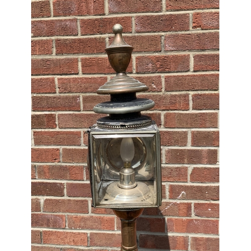 358 - An unusual vintage copper based standard lamp with carriage lamp style top, adjustable column and fo... 