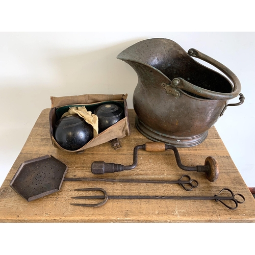 42 - A mixed lot comprising of a copper coal helmet, wooden bowls, metal skimmer etc