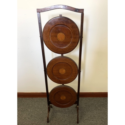 43 - An Edwardian inlaid wooden three shelf folding cake stand, 35