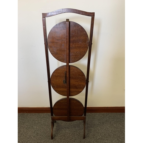 43 - An Edwardian inlaid wooden three shelf folding cake stand, 35