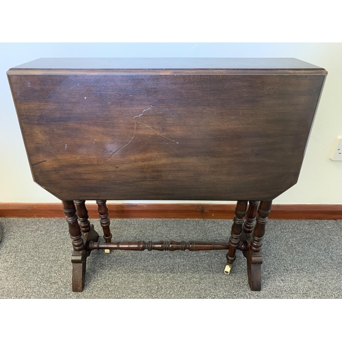 45 - A small vintage drop flap table on ceramic castor wheels, approx. 24