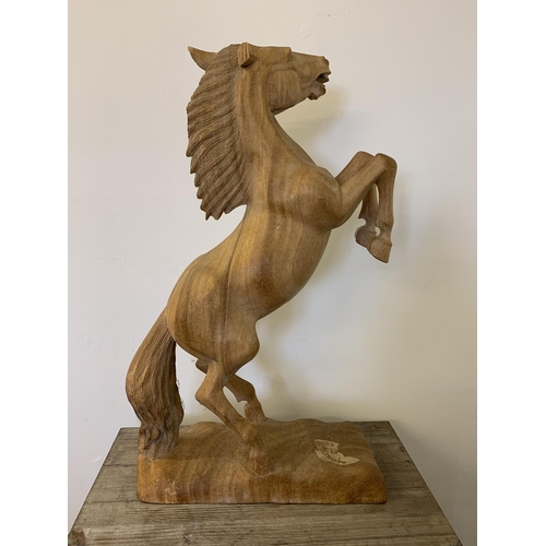 48 - A carved wood figure of a rearing horse, approx. 24