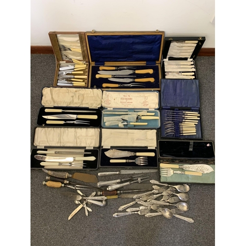 98 - A large box of cased carving sets, fish eaters and servers, one set consists of five pieces with hal... 