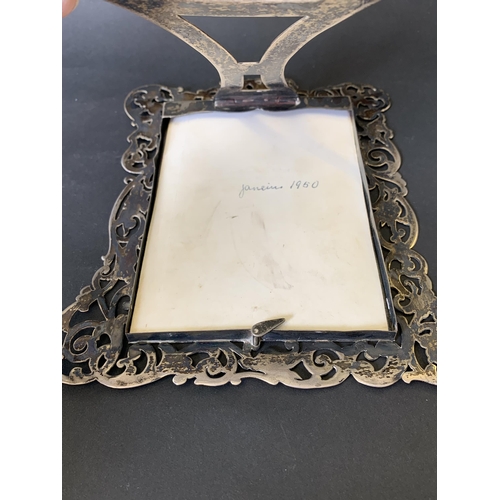 103 - A decorative hallmarked silver photograph frame, weight approx. 120g (without glass), comes with a p... 