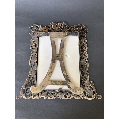 103 - A decorative hallmarked silver photograph frame, weight approx. 120g (without glass), comes with a p... 