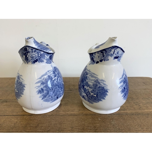 145 - A pair of Woods ware English Scenery pattern 'Cosy' lidded jugs, 7