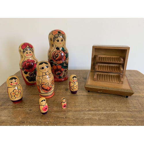 149 - A vintage wood cigarette box formally with a music box plus a vintage wood Russian nesting doll (woo... 