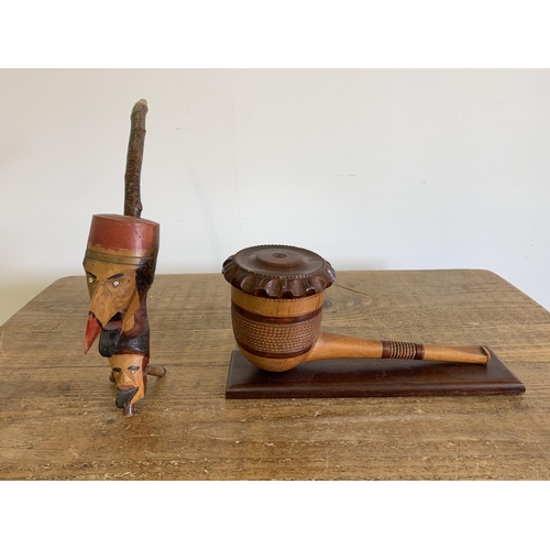 150 - A vintage very large ornamental wood pipe with hinged lid on wood stand, 10 1/4