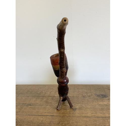 150 - A vintage very large ornamental wood pipe with hinged lid on wood stand, 10 1/4