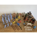 A box of various plastic Timpo, Britains, Cowboys and Indians etc