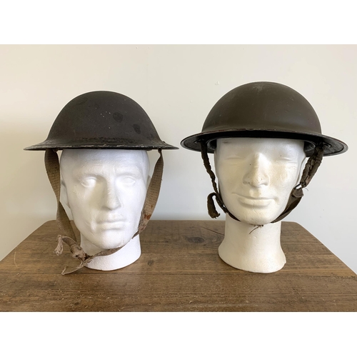 247 - Two WW2 combat Brodie steel helmets, one dated 1939